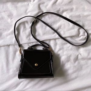 Urban Outfitters mini black trapezoid bag